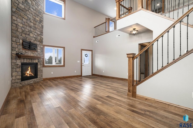 unfurnished living room featuring hardwood / wood-style floors and a fireplace