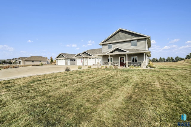 craftsman-style house with a garage, covered porch, and a front lawn