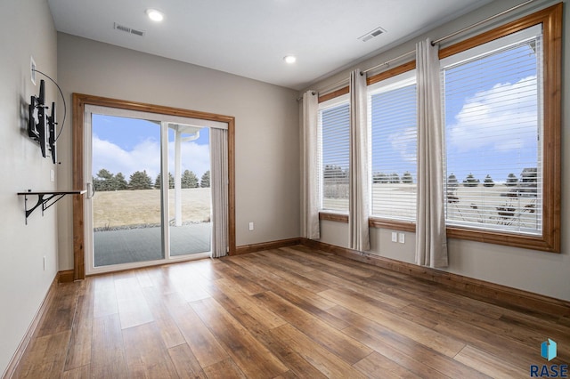 empty room with wood-type flooring