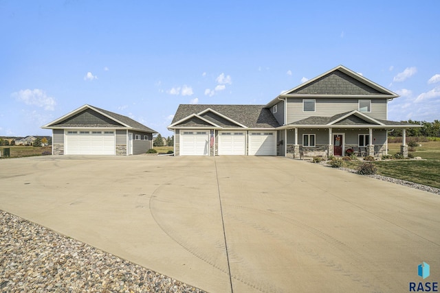 view of front of property featuring a garage and covered porch