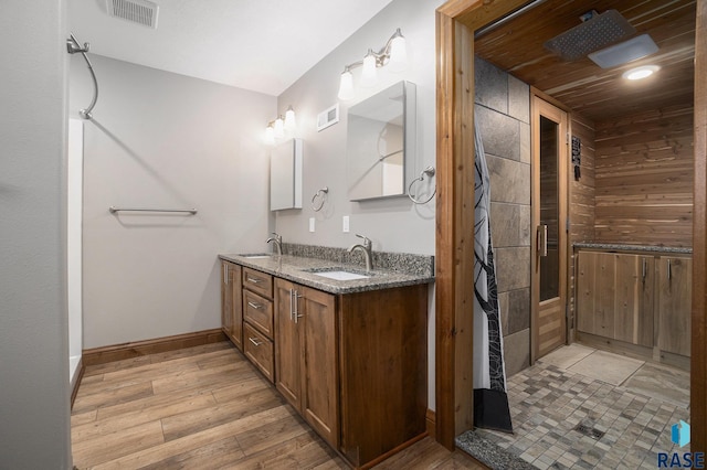 bathroom with vanity and hardwood / wood-style floors