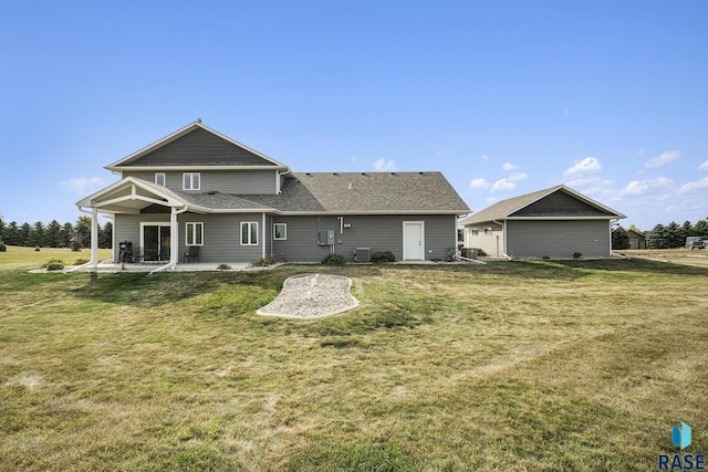 back of house with a patio, central AC unit, and a lawn