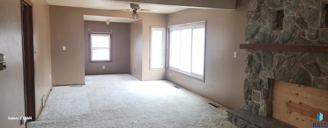 carpeted living room featuring ceiling fan