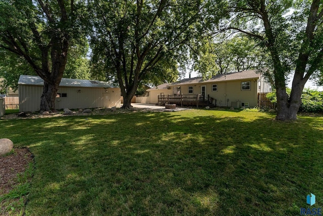 view of yard with a patio and a deck