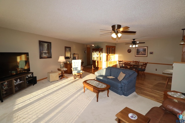 living room featuring hardwood / wood-style flooring and a textured ceiling