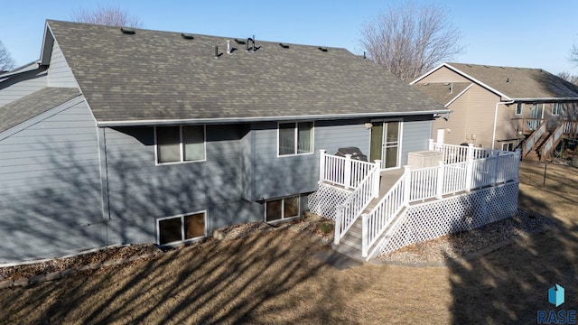 back of property featuring a deck