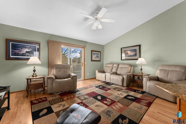 living room with vaulted ceiling, ceiling fan, and hardwood / wood-style floors