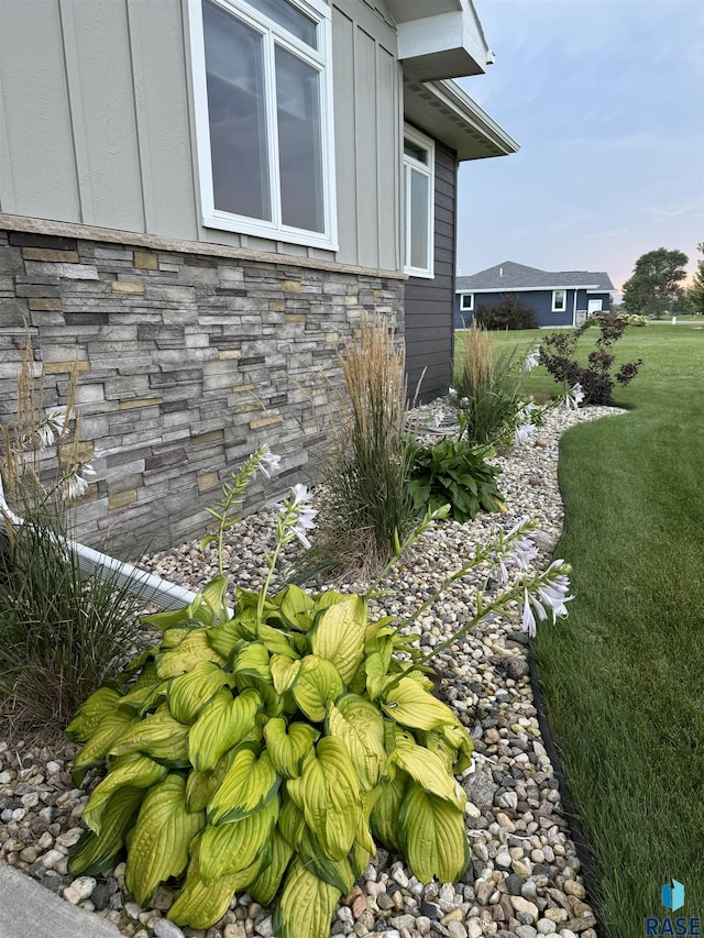 view of home's exterior with a yard