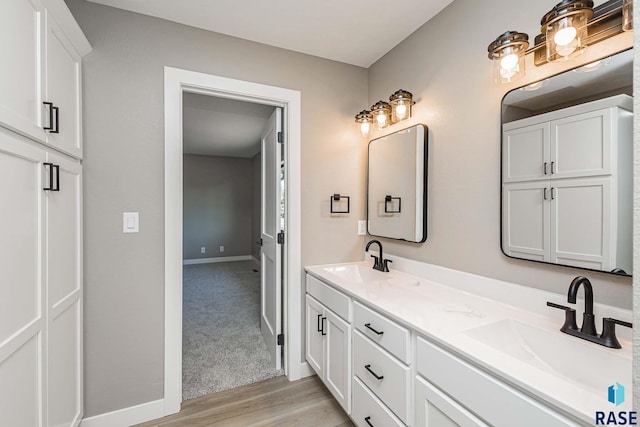 bathroom with vanity and hardwood / wood-style flooring