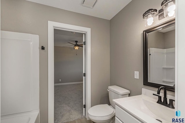 full bathroom with ceiling fan, vanity, toilet, and  shower combination