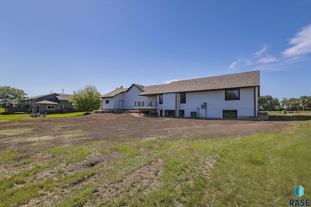 rear view of house with a lawn