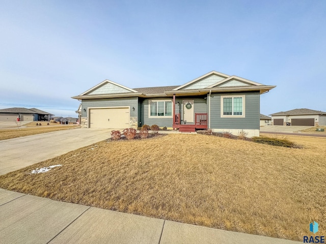 ranch-style house with a garage and a front yard