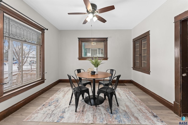 dining space featuring light hardwood / wood-style floors and ceiling fan