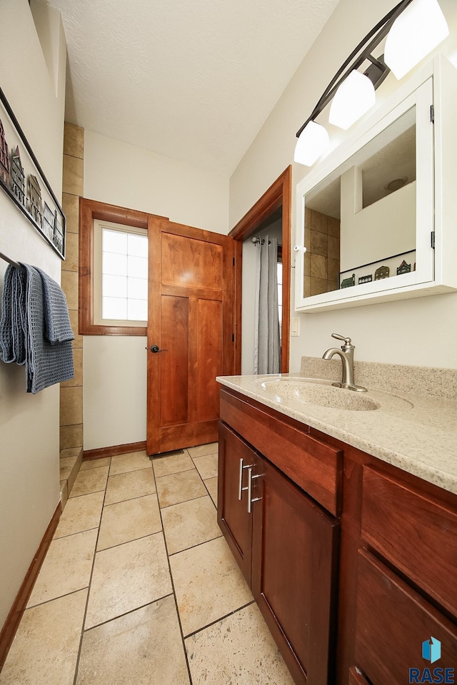 bathroom featuring vanity and tile patterned flooring