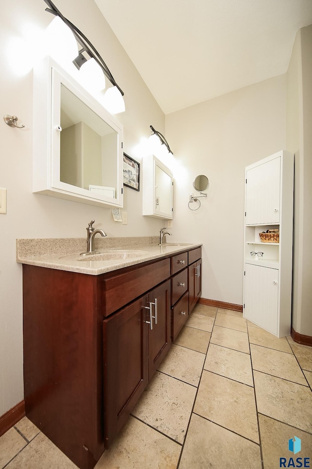 bathroom with vanity and tile patterned floors