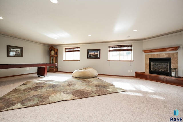 workout area featuring ornamental molding, light carpet, and a fireplace