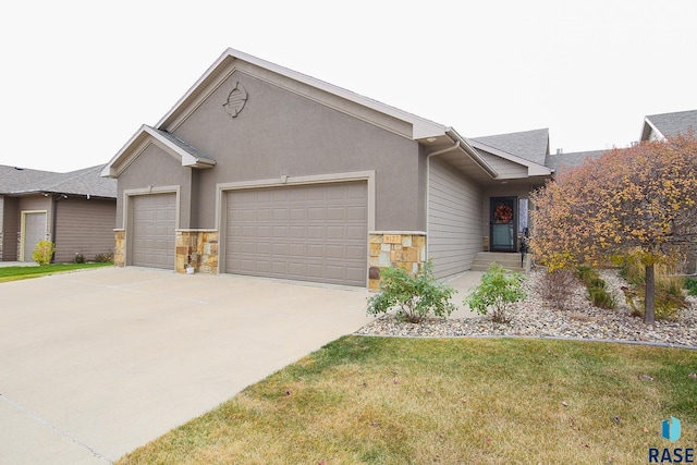 ranch-style house featuring a garage and a front yard