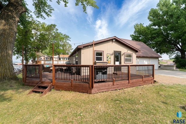 back of property with a wooden deck and a yard