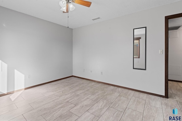 empty room featuring ceiling fan