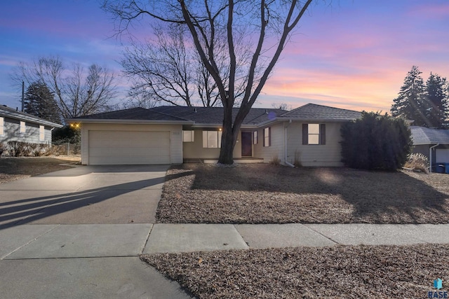 single story home featuring a garage