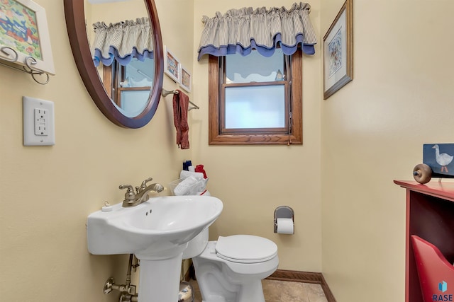 bathroom with tile patterned floors and toilet