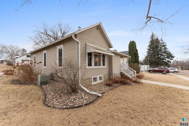 view of home's exterior featuring central AC unit