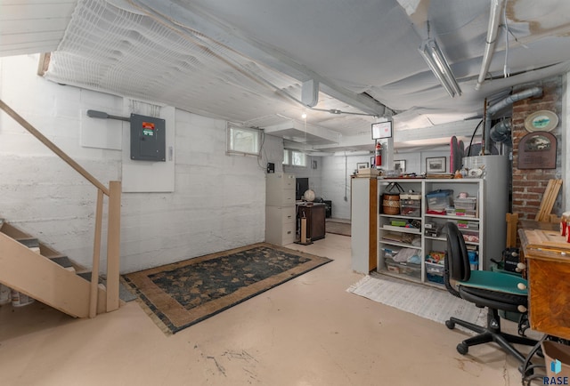 basement with electric panel and gas water heater