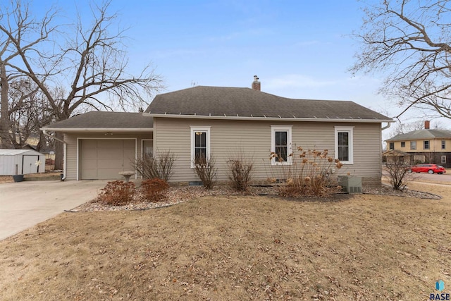 view of side of home with a garage, a lawn, and central air condition unit