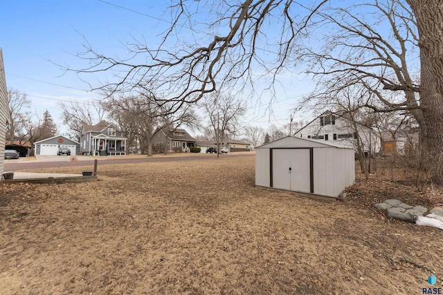 view of yard with a storage unit