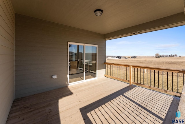 wooden terrace with a rural view