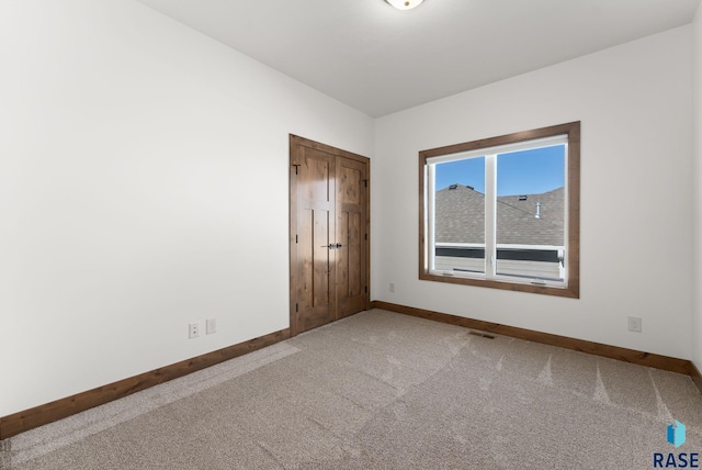 spare room featuring carpet flooring