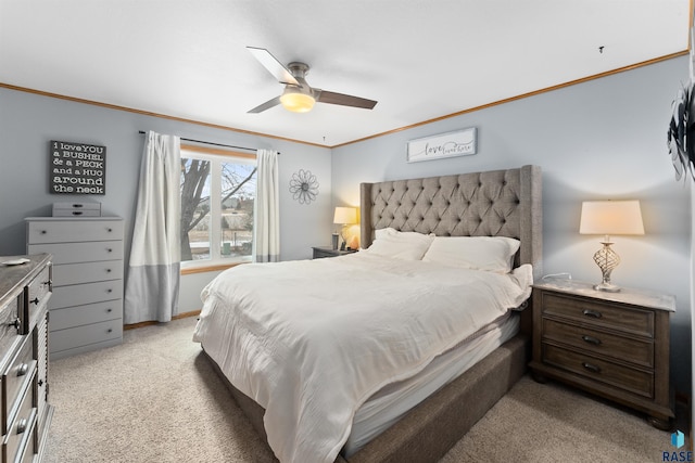 carpeted bedroom featuring ornamental molding and ceiling fan