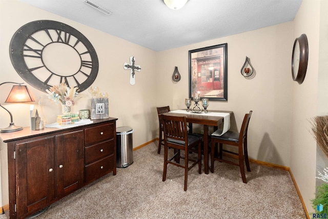 view of carpeted dining area