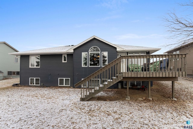 back of property featuring a wooden deck