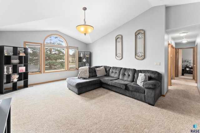 carpeted living room featuring vaulted ceiling