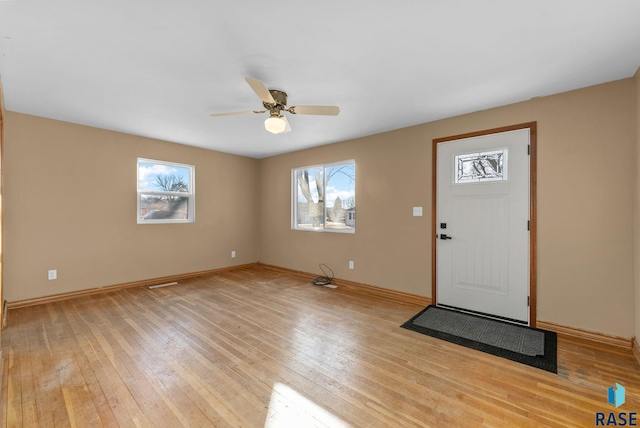 entryway with ceiling fan and light wood-type flooring