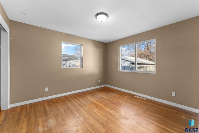 unfurnished bedroom with hardwood / wood-style flooring