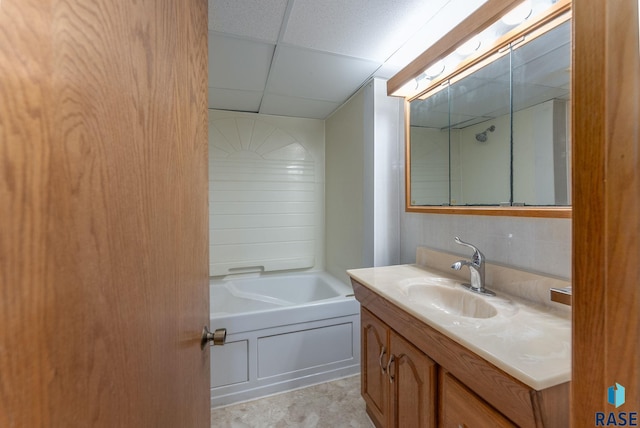 bathroom with vanity and a paneled ceiling