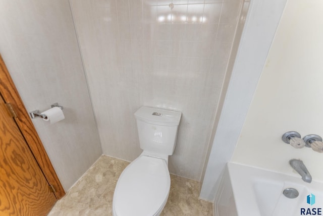 bathroom with toilet and shower / bath combination