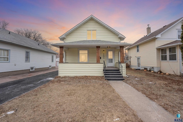 bungalow featuring covered porch