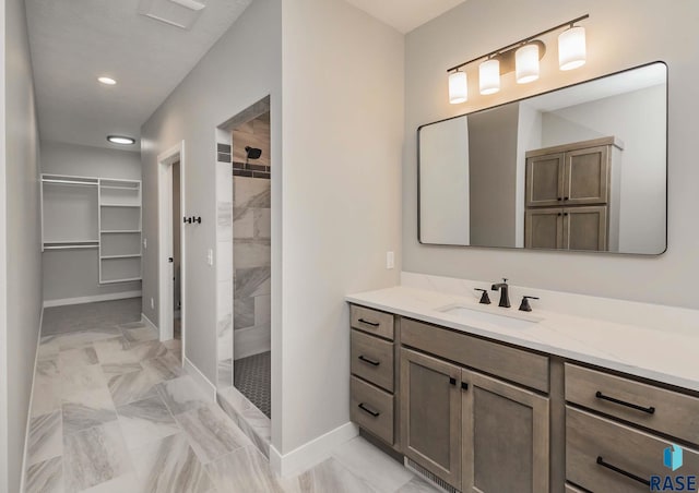 bathroom featuring vanity and a tile shower