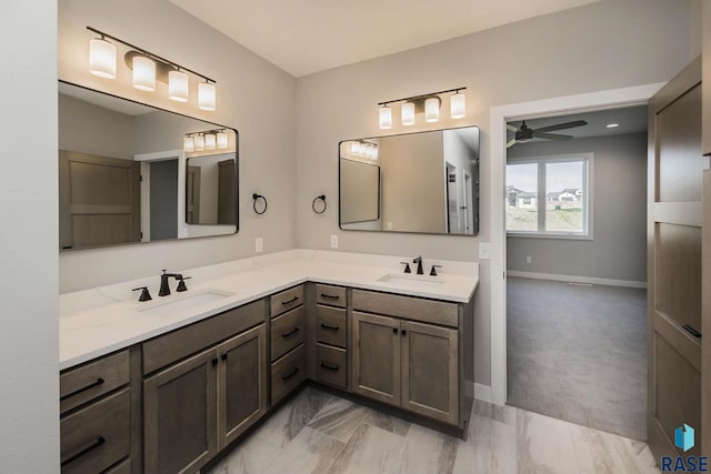 bathroom with ceiling fan and vanity