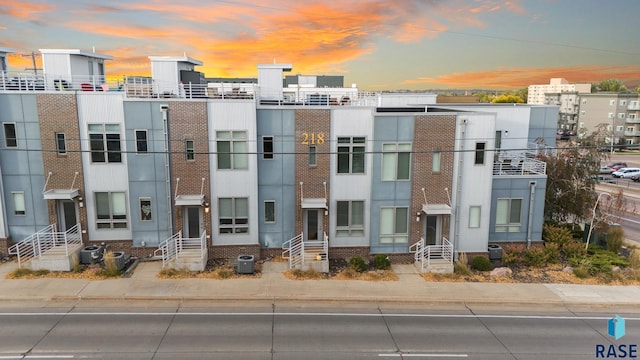 outdoor building at dusk featuring central AC