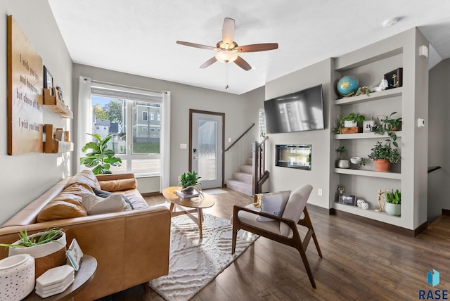 living room with ceiling fan, dark hardwood / wood-style flooring, and built in features