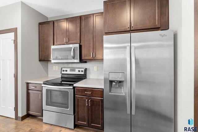 kitchen with tasteful backsplash, appliances with stainless steel finishes, and dark brown cabinetry