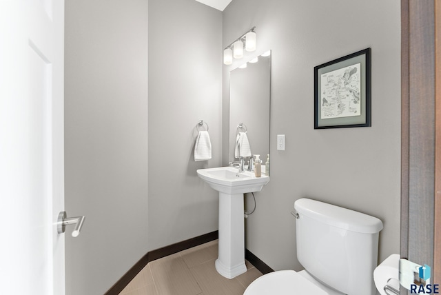 bathroom featuring tile patterned floors and toilet