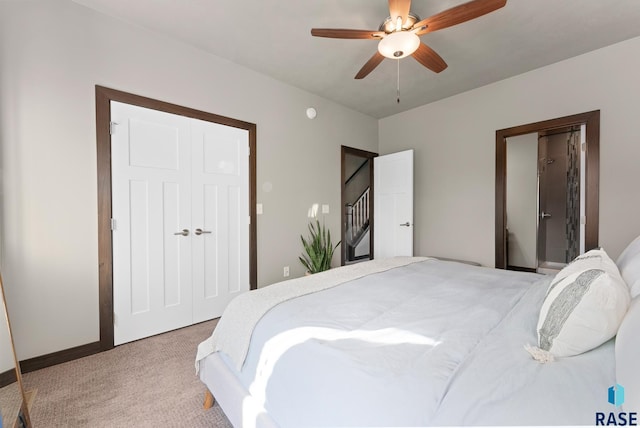 bedroom with ceiling fan and light colored carpet