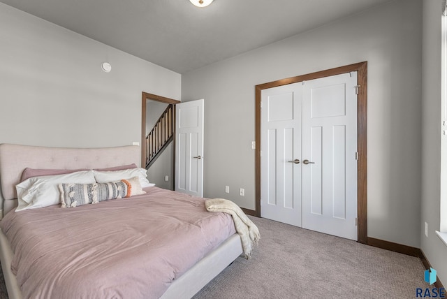 carpeted bedroom with a closet