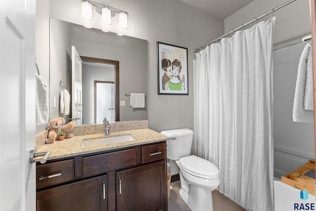 full bathroom with vanity, shower / bath combo, and toilet