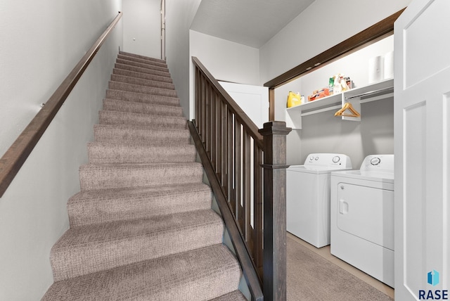 stairway featuring washing machine and dryer